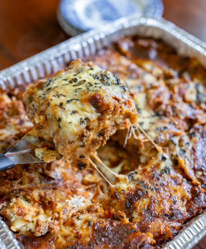 image of baked homemade freezer lasagna in a foil disposable pan