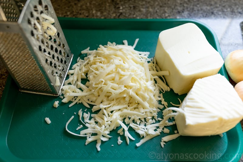 image of home-shredded blocks of cheese for freezer lasagna