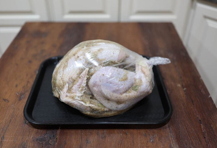 image of a Thanksgiving turkey marinating in a turkey bag.