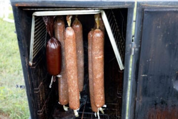image of homemade sausage making smoking in the smoker chamber