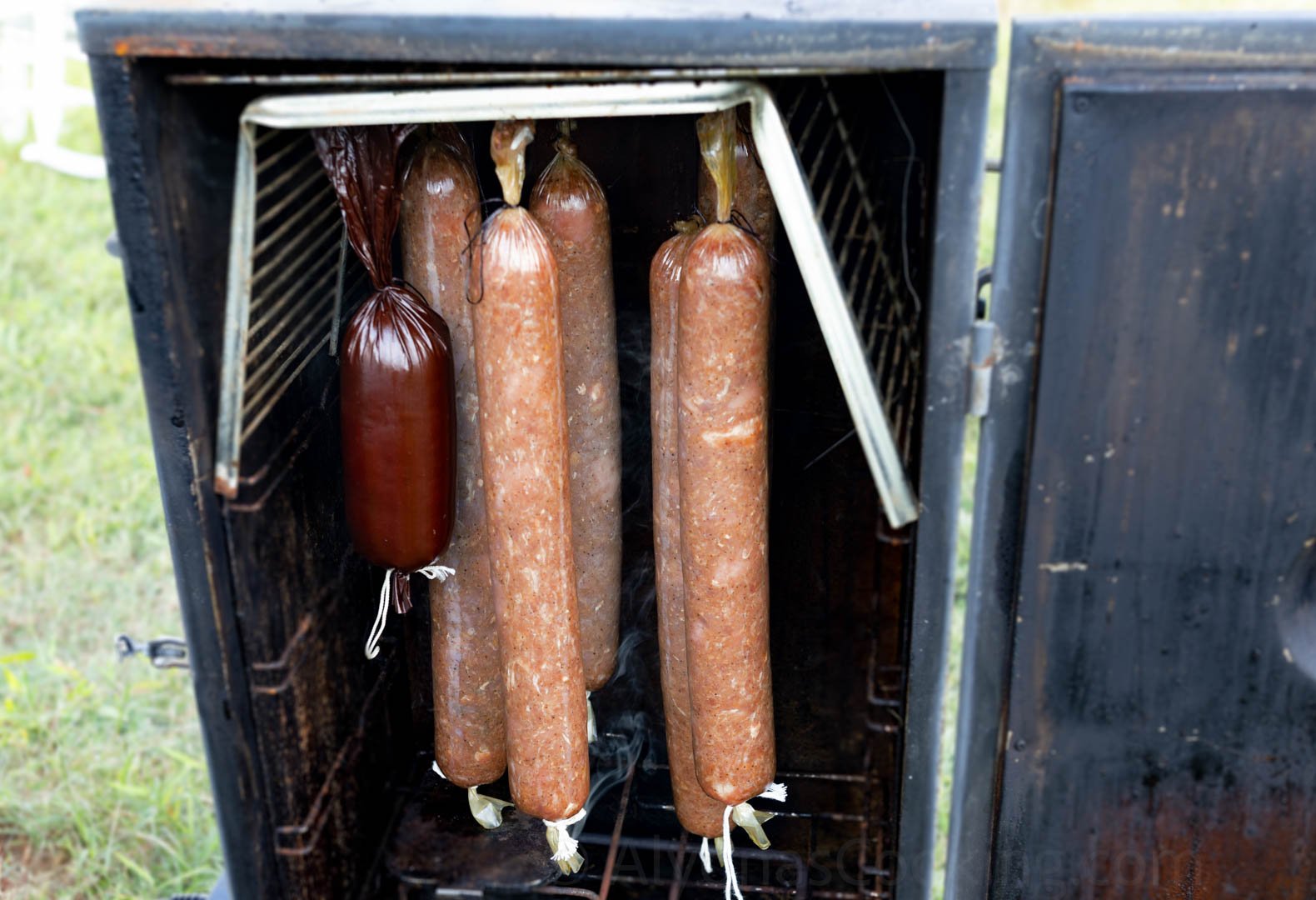 image of homemade sausage making smoking in the smoker chamber