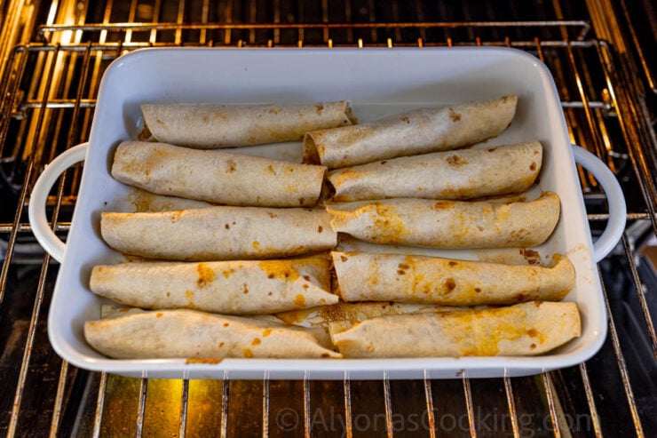 image of salsa chicken enchiladas baked in the oven for crispiness and gold brown color