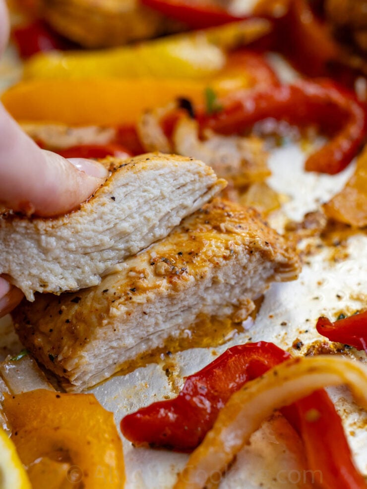 image of juicy and tender Italian chicken roasted in the oven with bell peppers and onions
