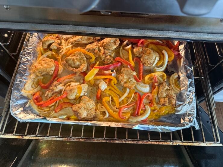 image of sheet pan Italian chicken roasted with bell peppers and onions in Italian Dressing