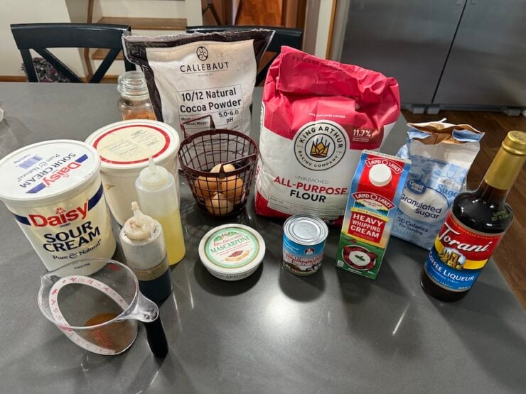 image of all the tiramisu cake ingredients (for sponge layers, coffee syrup, and cocoa cream frosting)