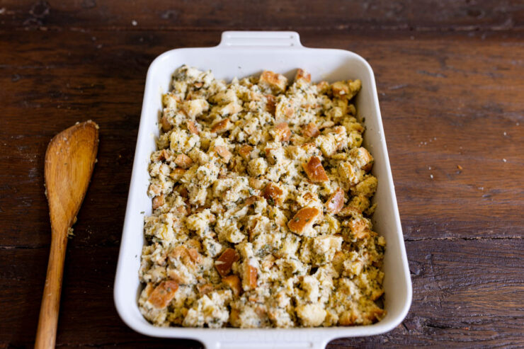 image of homemade stuffing in a baking dish ready to baked