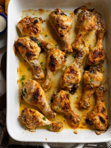 easy baked chicken drumsticks smeared with mayonnaise and seasonings then baked in the oven