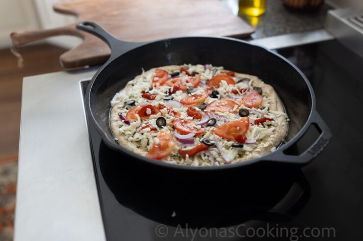 image of pesto pizza made with a healthy sourdough pizza dough made with 100% fresh milled flour