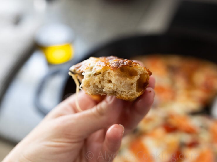 image of a soft, thick and crusty sourdough pizza crust made with freshly milled flour