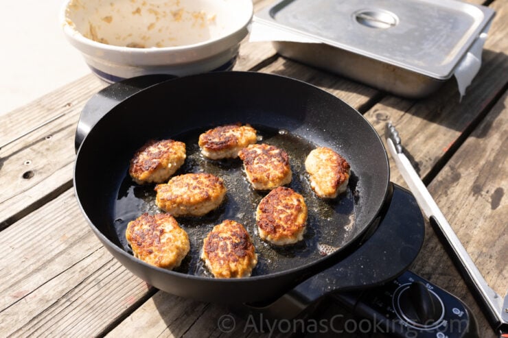 frying chicken kotleti (meatballs/cutlets) in an electric skillet outdoors to keep the oil splatters at a minimum 
