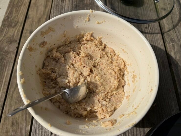 shaping the ground chicken mixture for kotleti patties using a 1/4 measuring scoop