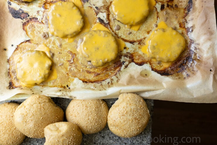 image of oven burgers on a sheet pan with melted American cheese