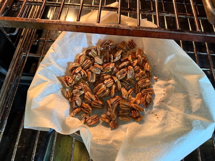 image of maple candied pecans toasting in the oven