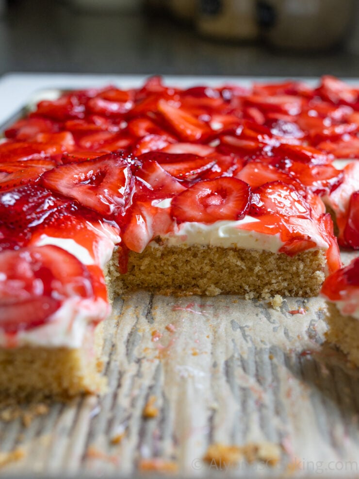 Close-up on strawberry sheet cake made with a homemade yellow cake mix