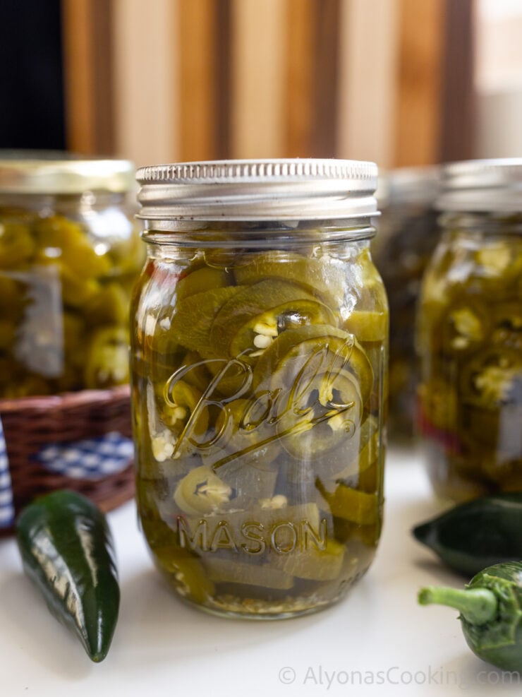 image of a jar of canned pickled jalapeños after water bath canning